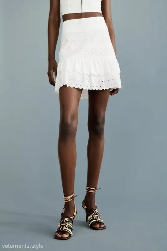 White eyelet mini skirt paired with French Niche Hollow Cutout Cotton Crop Top for Summer