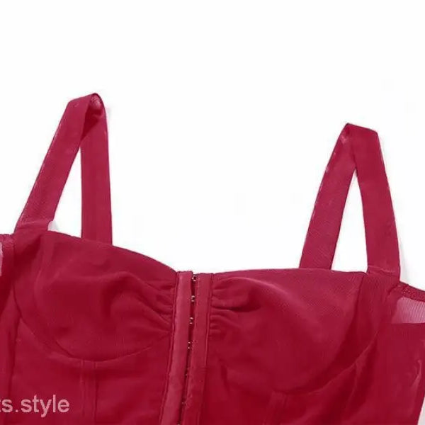 Red bustier-style top with shoulder straps and front closure, perfect for sexy halter spaghetti looks