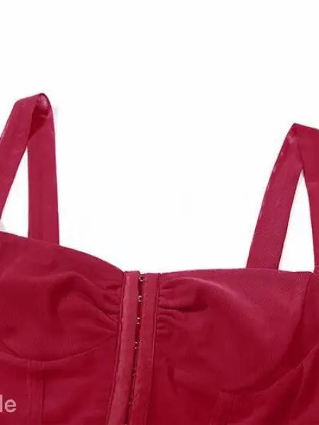 Red bustier-style top with shoulder straps and front closure, perfect for sexy halter spaghetti looks
