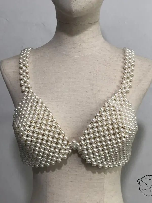 Pearl bra on mannequin showcasing handmade pearl bra and sexy handmade pearl design