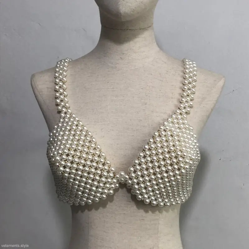 Pearl bra on mannequin showcasing handmade pearl bra and sexy handmade pearl design