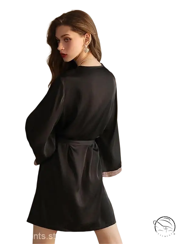 Woman in black ice silk robe with tie waist, long sleeve lace and tulle, facing away