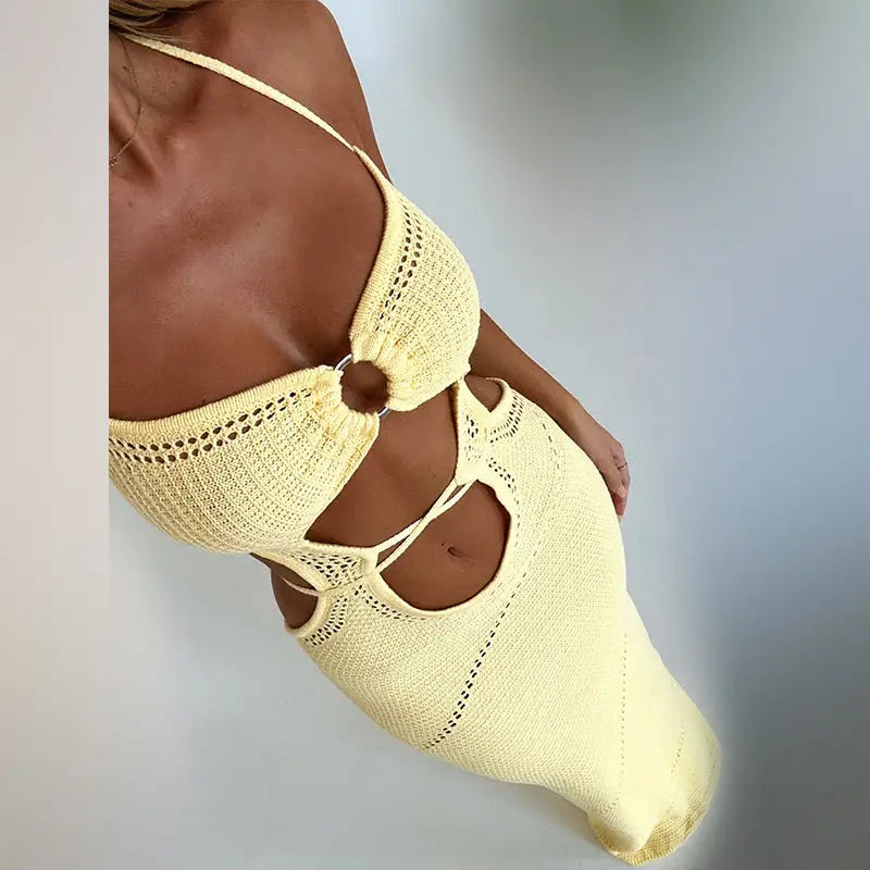 Yellow knitted beach dress with cutouts and ring accent, perfect for summer parties