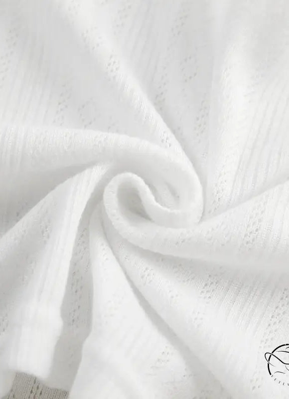White semi-sheer fabric with small perforations twisted into a spiral for knitted shorts homewear set