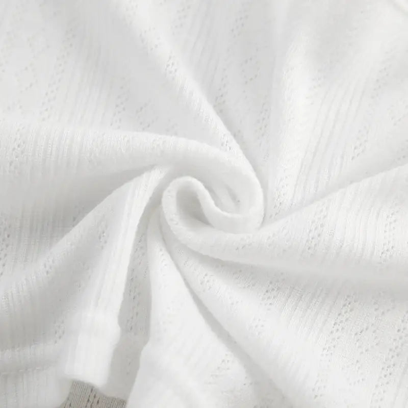 White semi-sheer fabric with small perforations twisted into a spiral for knitted shorts homewear set