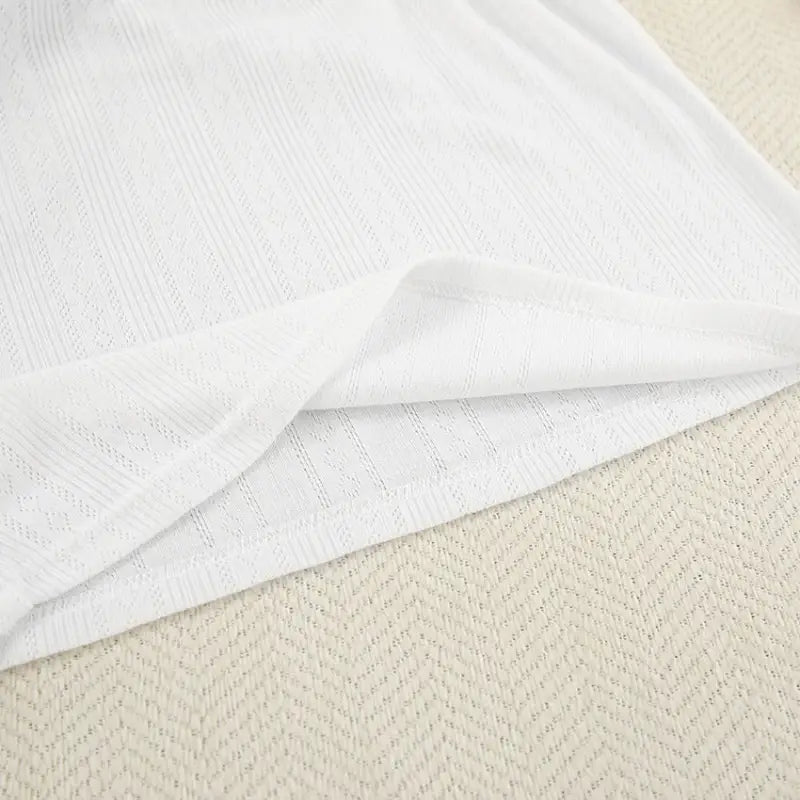 White textured loosely woven fabric from knitted shorts homewear set with sleeveless crop top