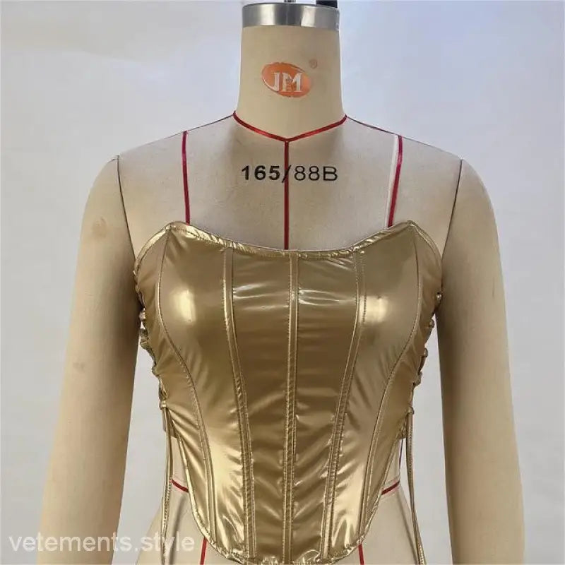 Glittering powder finish on a shiny gold strapless corset top with side lacing, free shipping available