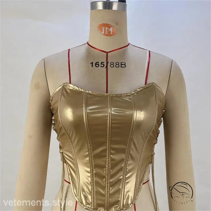 Shiny gold strapless corset top with vertical boning and side lacing