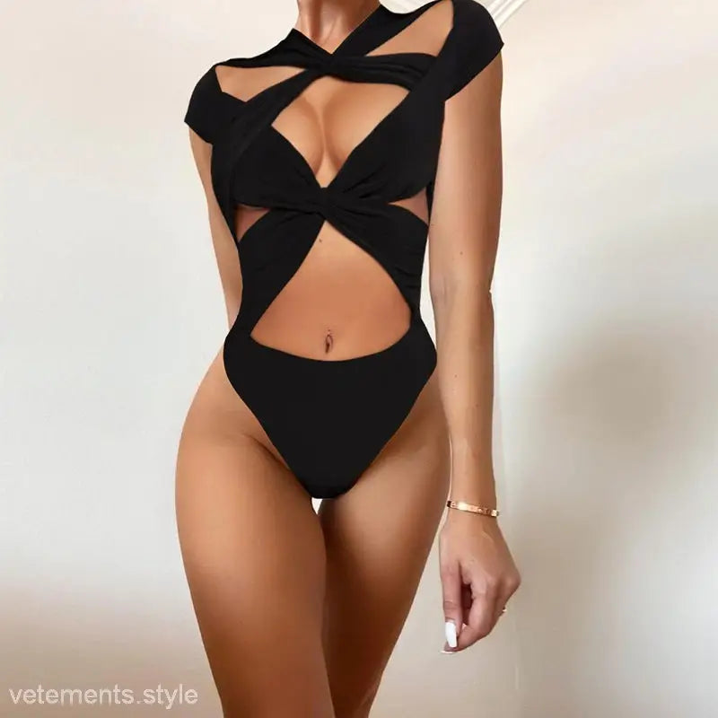 Black cutout bodysuit with crisscross straps, featured in Lace Cutout V-Neck Short Sleeve White Cross Jumpsuit