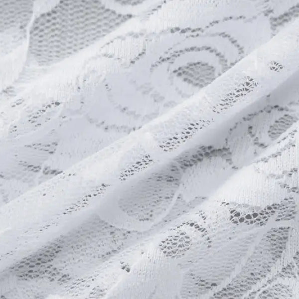 Delicate white lace fabric with floral patterns.