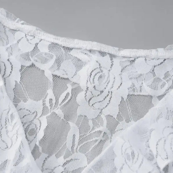 Delicate white lace fabric with a floral pattern.