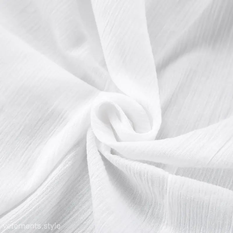 Delicate white fabric showcasing soft folds in a sexy long sleeve pajama set