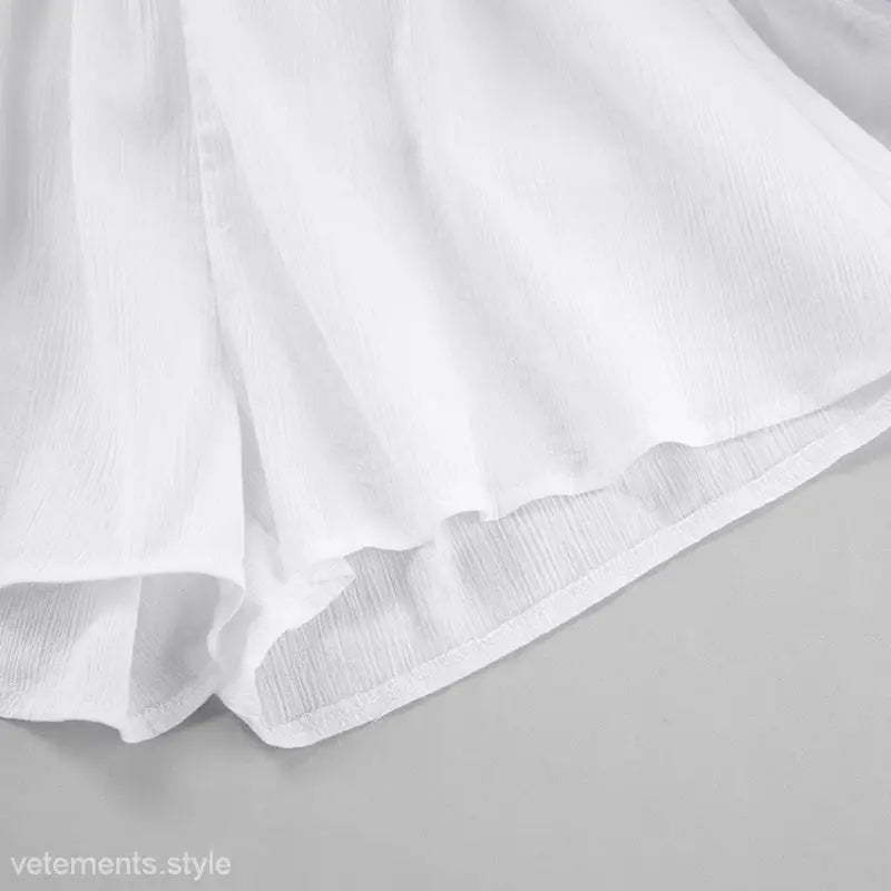 Flowing white fabric showcasing delicate folds in sexy long sleeve shorts pajamas