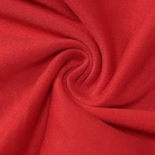 Red fabric with a swirling pattern showcasing the sexy metal buckle in a buckle yoga jumpsuit