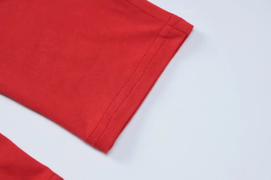 Red fabric sleeve of Metal Buckle Yoga Jumpsuit for Summer Wear showcasing sexy metal buckle