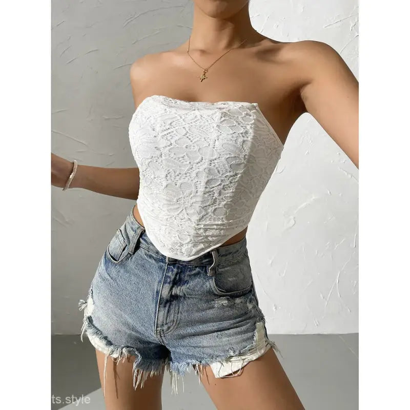White lace strapless bandana tube top paired with distressed denim shorts, perfect for a sexy off-shoulder corset look
