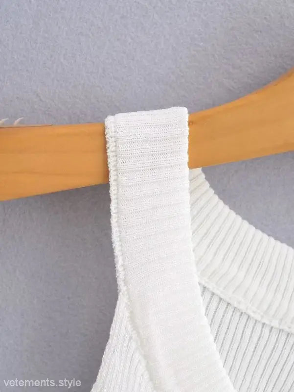White ribbed tank top on hanger, perfect as a sexy pearl vest for summer style