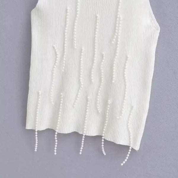 White ribbed knit sleeveless top with dangling pearl embellishments, a stylish sexy pearl vest for summer