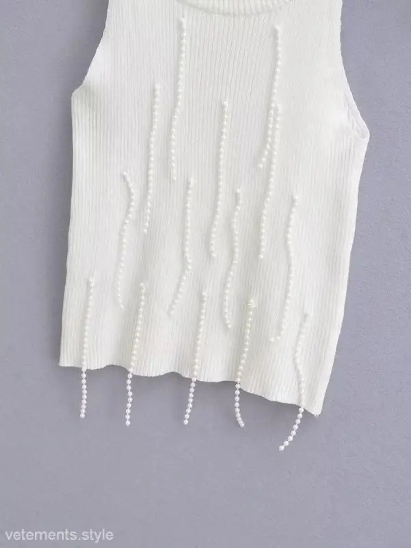 White ribbed knit sleeveless top with dangling pearl embellishments, a stylish sexy pearl vest for summer