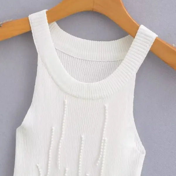 White knitted tank top with vertical beaded embellishments, part of the sexy pearl vest collection