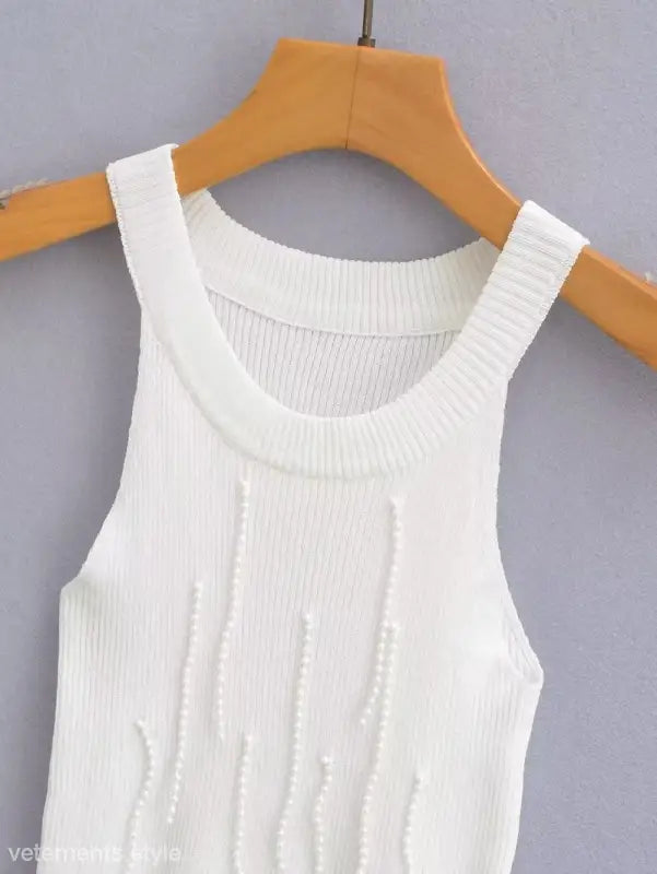 White knitted tank top with vertical beaded embellishments, part of the sexy pearl vest collection