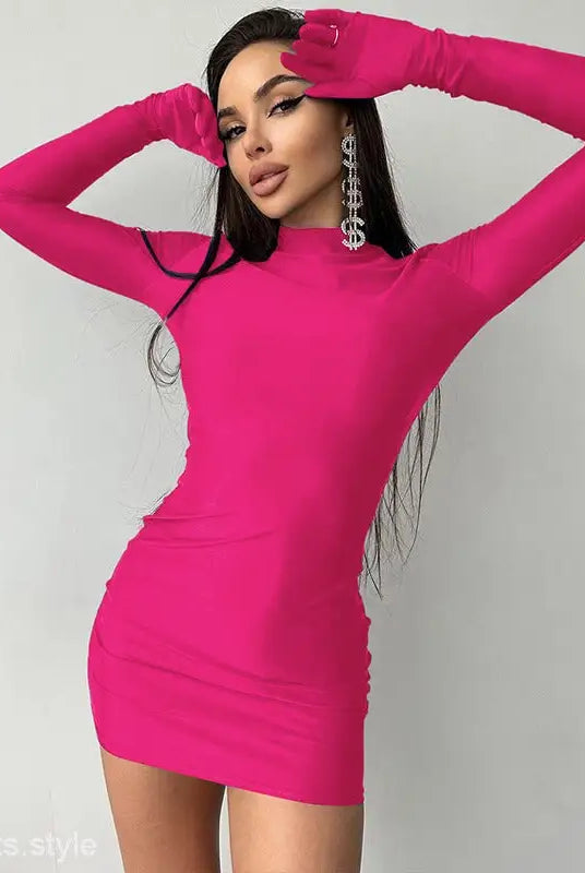 Woman in a sexy sheath long party bodycon dress with long sleeves and dangling earrings