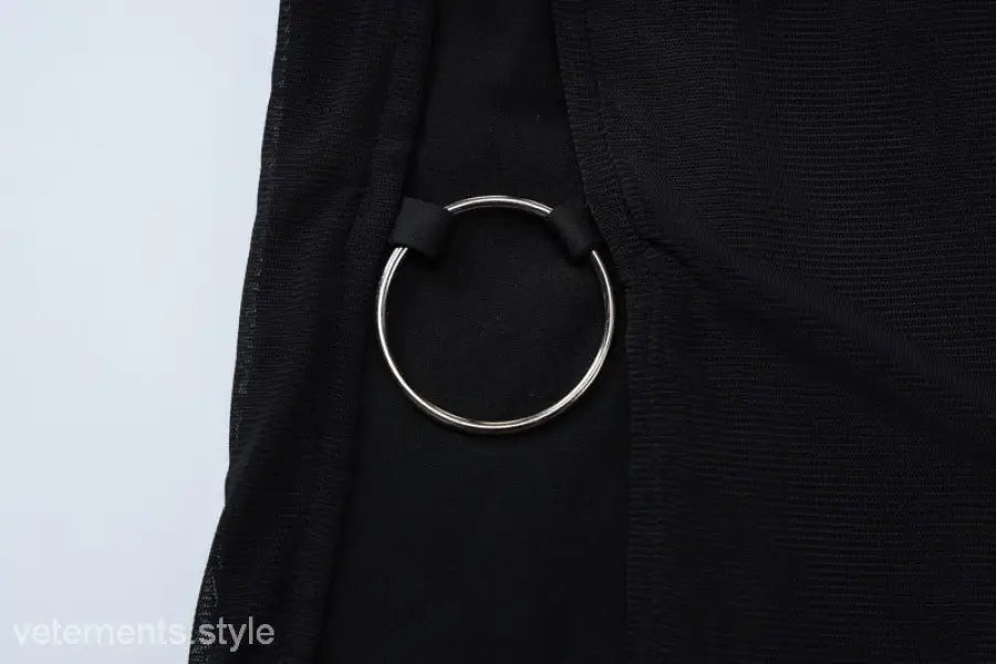 Silver ring detail on black fabric of sexy short mesh dress for summer parties