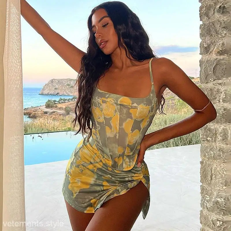 Floral print corset dress complementing a sexy short slim fit tank for summer elegance