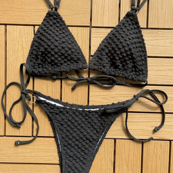 Black crocheted bikini with triangle top and tie-side bottom.