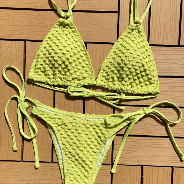 Lime green crocheted bikini with a textured pattern.