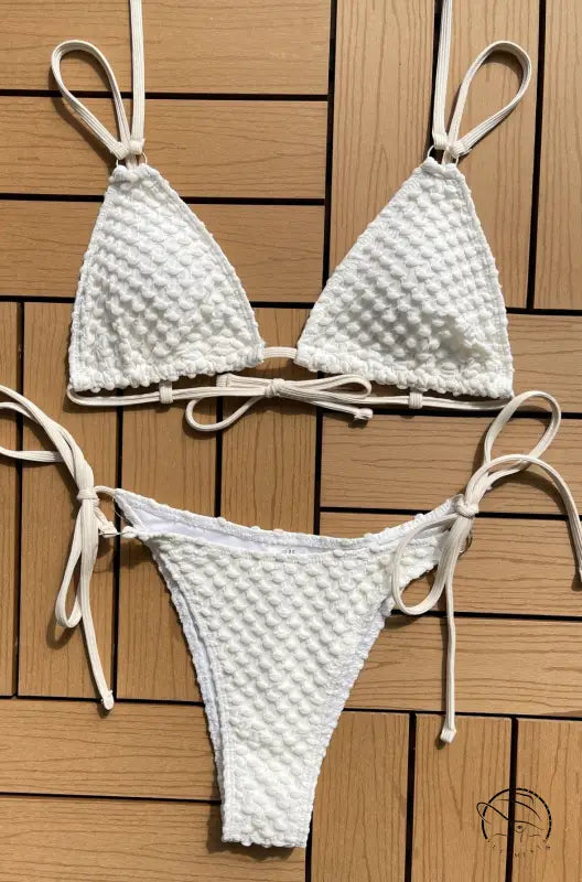 Sexy single swimsuit with white textured triangle top and boho tie straps