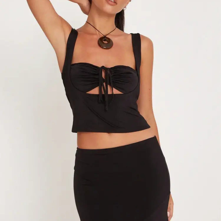 Fashionable black crop top and skirt set with slim cutout design by Vetements Style