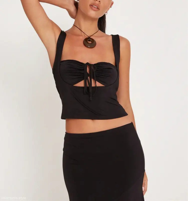 Fashionable black crop top and skirt set with slim cutout design by Vetements Style