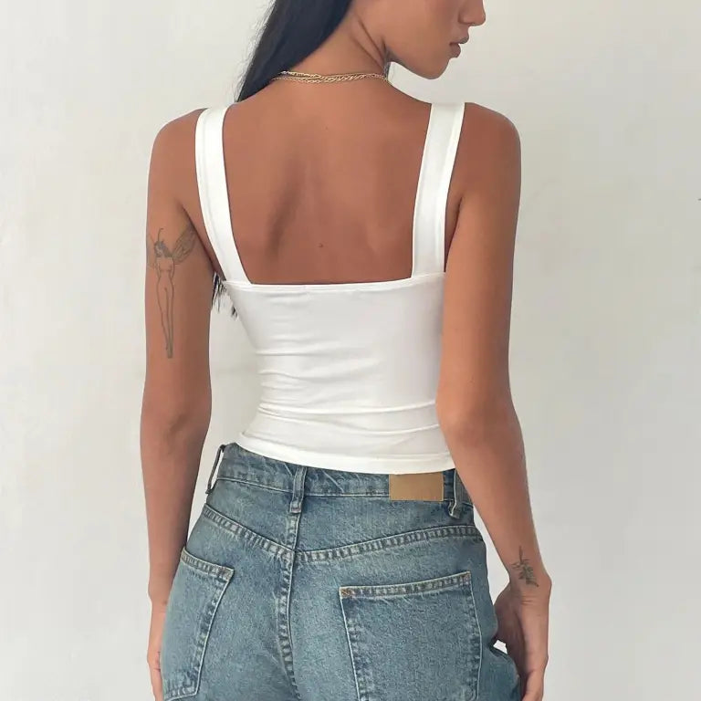Fashionable slim cutout camisole top by Vetements Style worn with blue jeans