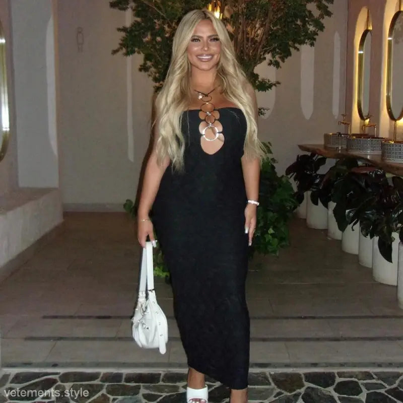 Blonde woman modeling sexy camisole dress with metal ring cutout for slim fit appeal