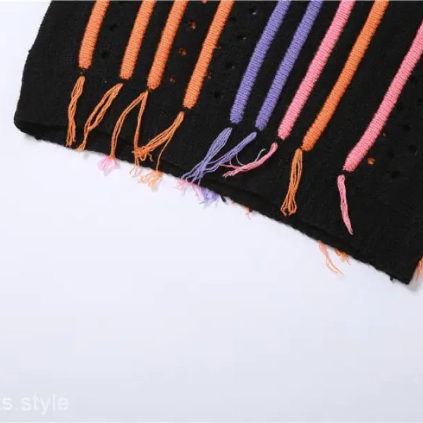 Black knit fabric with colorful stripes and fringe from Slim Street Dress with Color Block Fringe