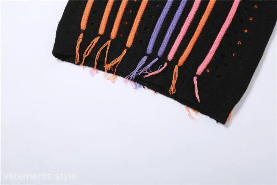 Black knit fabric with colorful stripes and fringe from Slim Street Dress with Color Block Fringe