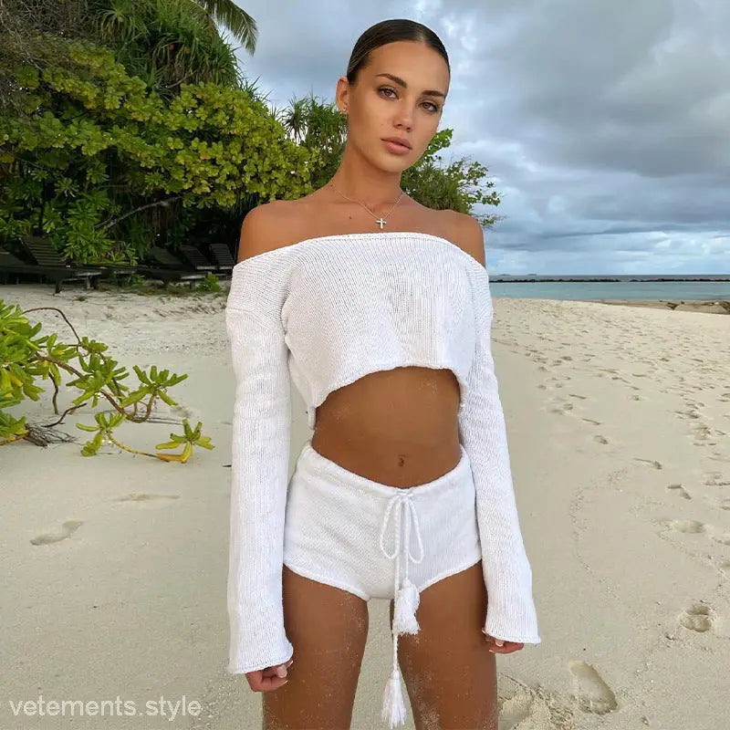 White off-the-shoulder long-sleeve crop top with matching sexy knitted striped shorts