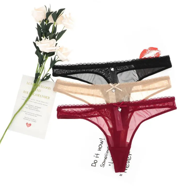 Three sexy T shaped low rise thongs in black, beige, and burgundy with lace trim
