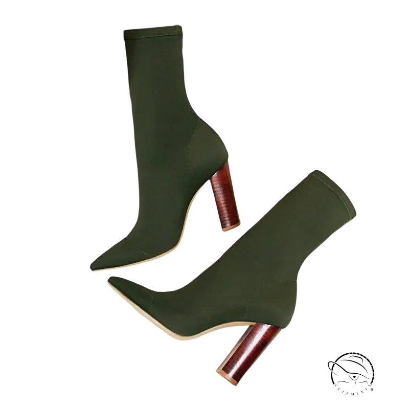 Pair of dark green high heels boots with pointed sexy talons heels