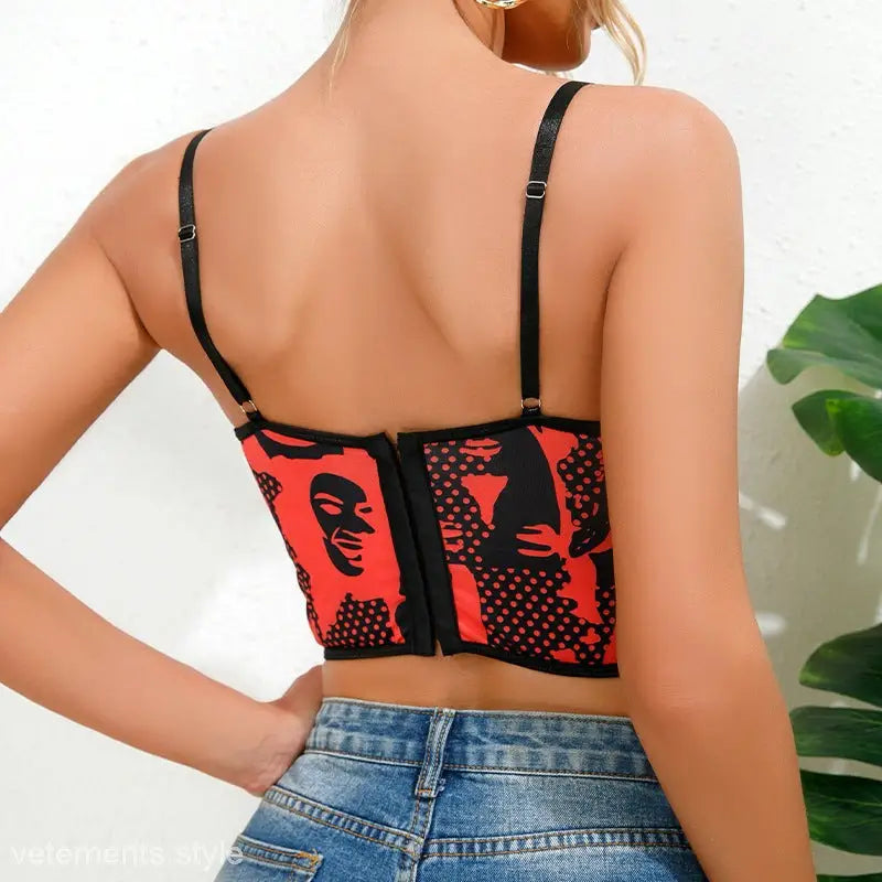 Red and black abstract print cami top with adjustable straps, ideal as a waist trimming corset