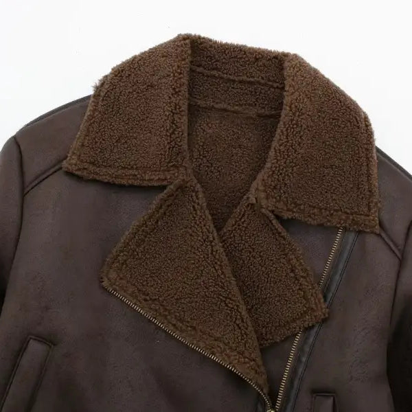 Brown leather shearling jacket with fleece short stitching, asymmetrical zipper, and pockets