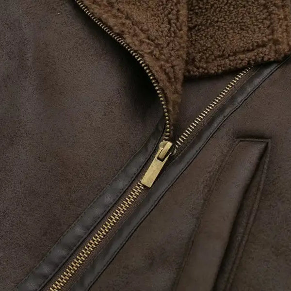 Brown leather jacket with fleece short stitching, gold zipper, and fleece collar