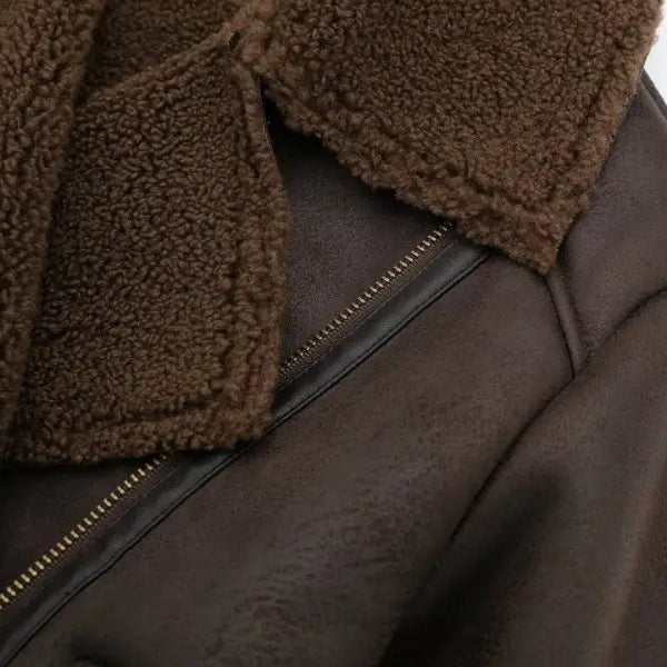 Brown leather shearling jacket with fleece short stitching, gold zipper, and fuzzy collar