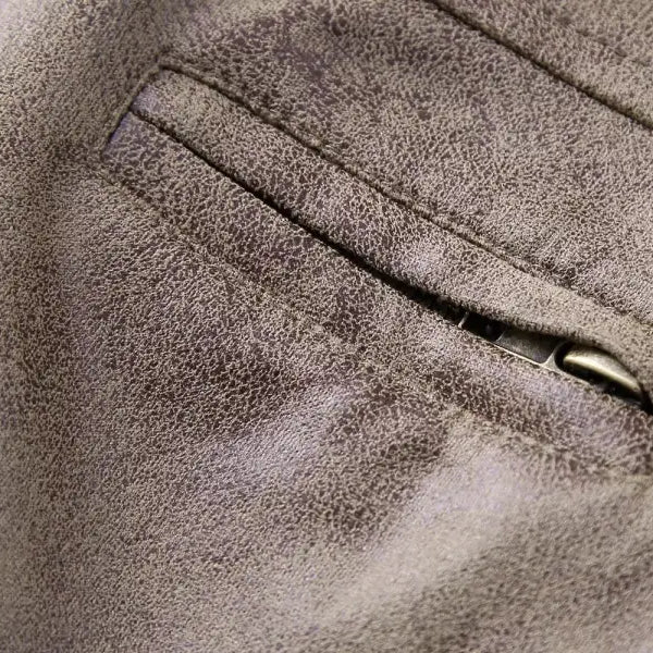 Gray suede jacket pocket from the Short Suede Stand Jacket with Pocket and Zipper Closure