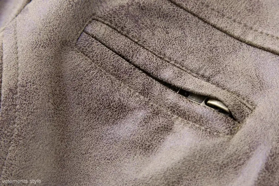 Gray suede jacket pocket from the Short Suede Stand Jacket with Pocket and Zipper Closure