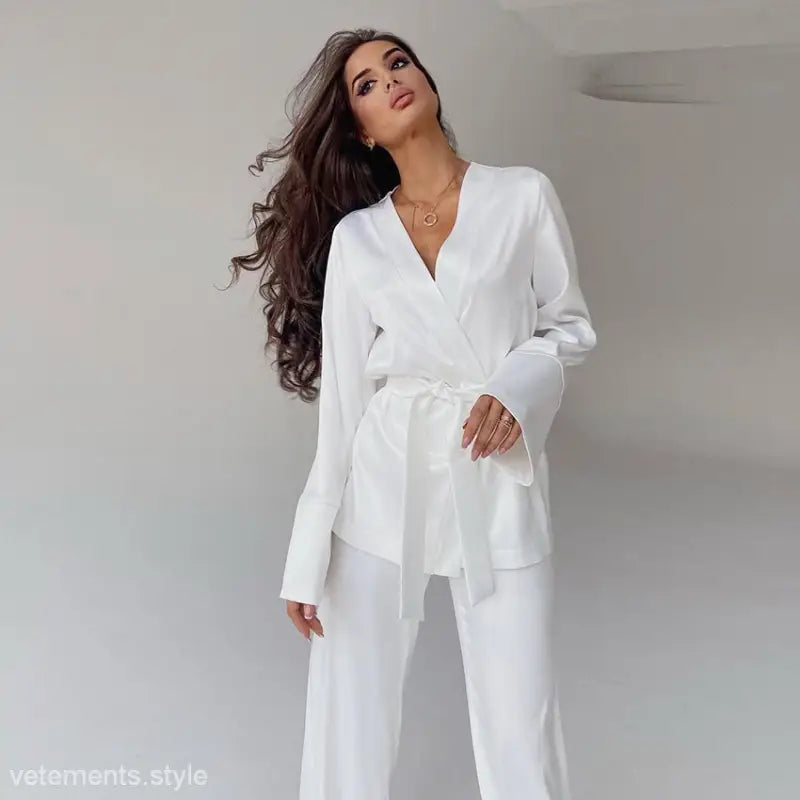 White linen pantsuit with v-neck blazer and wide-leg trousers featured in skin friendly cardigan
