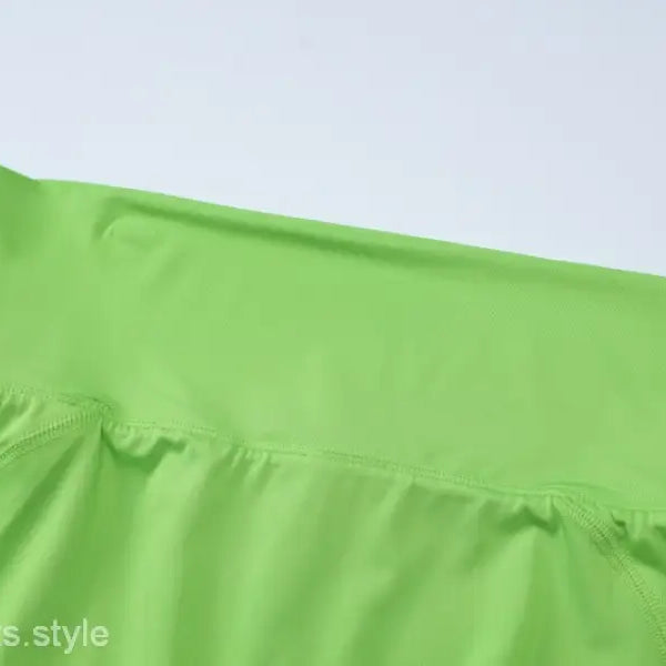 Lime green high-waisted leggings for slim shorts suit styling in summer vest and shorts ensemble