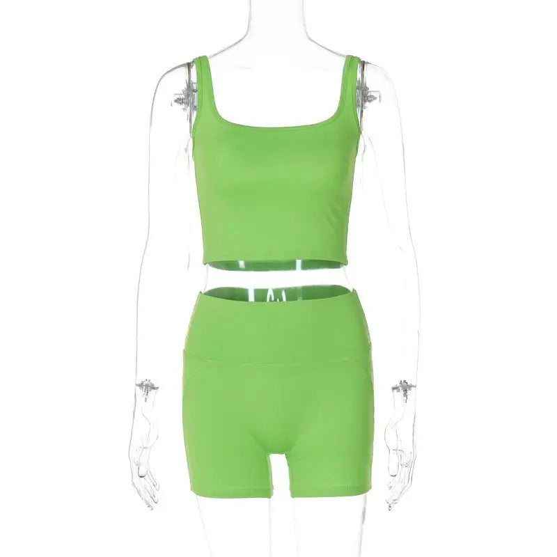 Green slim shorts suit featuring a two-piece crop top and matching vest for summer wear