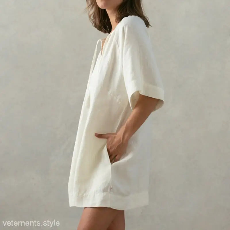 Loose-fitting white linen dress, perfect as a soft cotton nightdress with pockets in Apricot